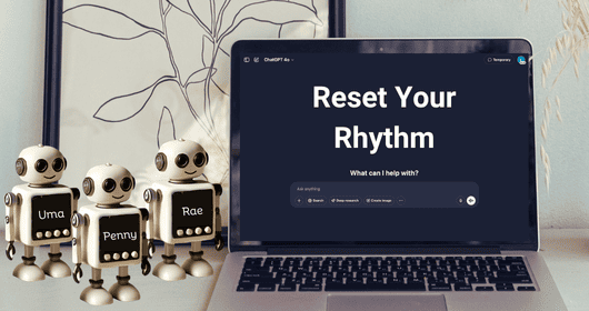 Laptop with 'Reset Your Rhythm' text on screen, accompanied by small robot figurines.