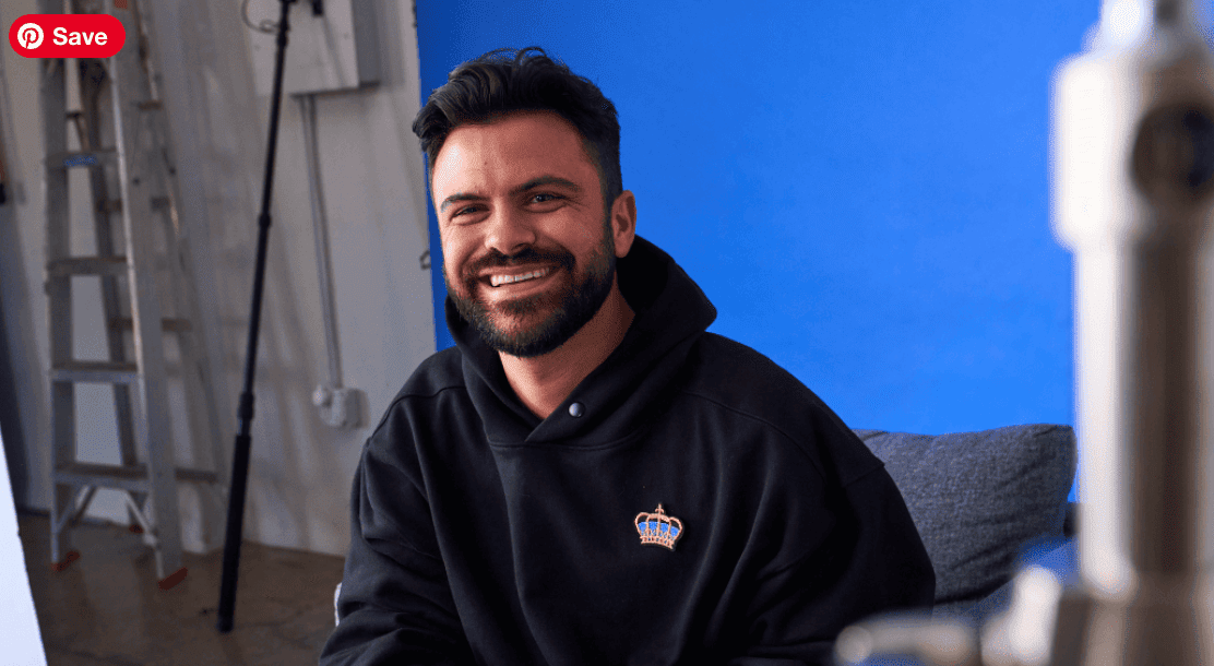 Tony DiBernardo wearing a black hoodie with a logo in a studio setting